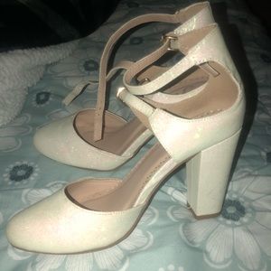 Glittery white heels.